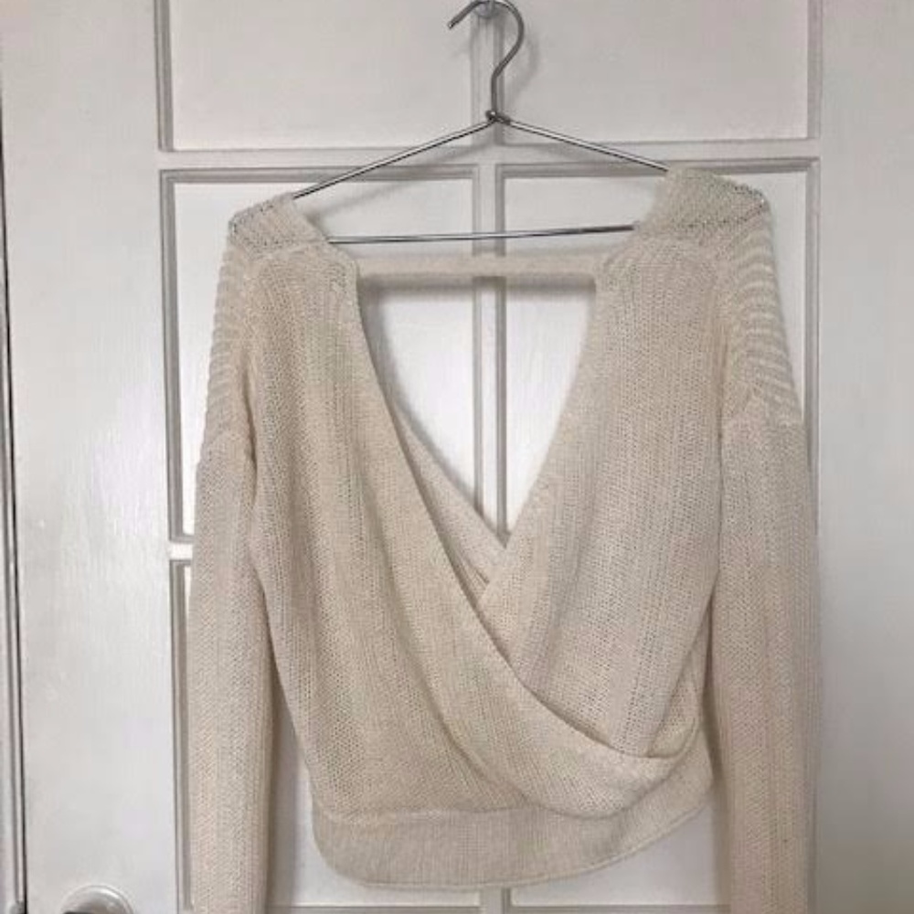 KNIT CROSSOVER SWEATER